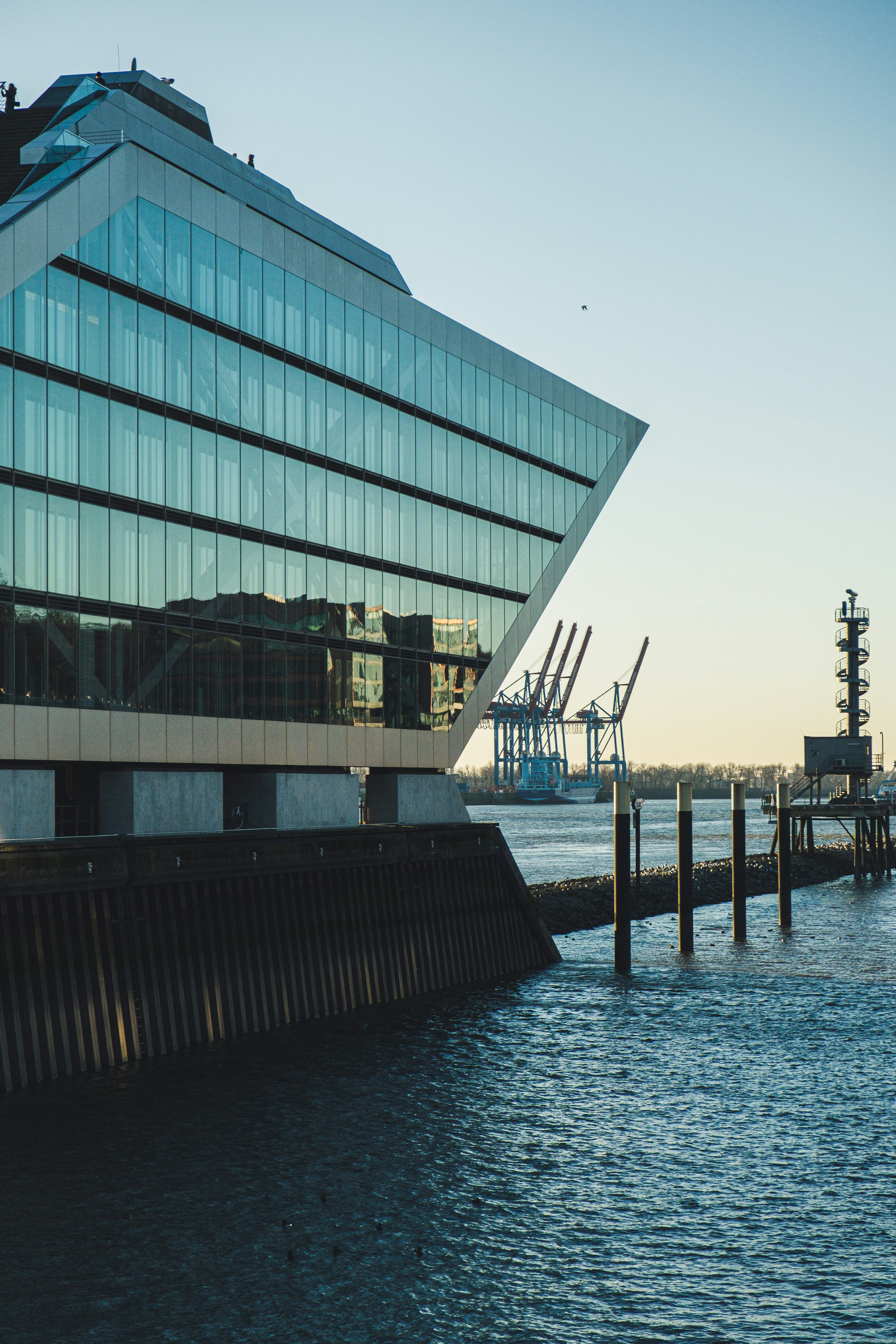 curtain wall building beside body of water